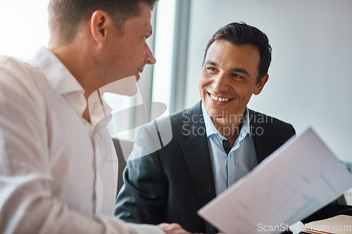 Image of Everything looks good to me. two mature businessmen discussing paperwork in a corporate office.