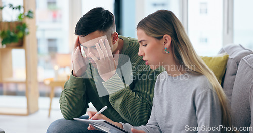 Image of Home, stress and couple with documents, finance and budget with taxes, debt and asset management in a lounge. Apartment, man or woman with paperwork, bills or payment discussion with mortgage or rent