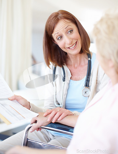 Image of Communicating clearly so her patient understands - Senior Health. Friendly mature nurse explains the outcome of her elderly patients medical tests.