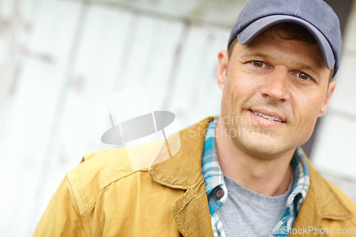 Image of Ready to start the day. Portrait of a smiling man with a cap on.