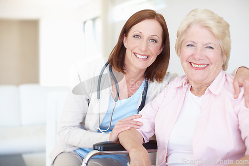 Image of Reliable and astute senior care. Smiling mature nurse embraces her delighted elderly female patient.