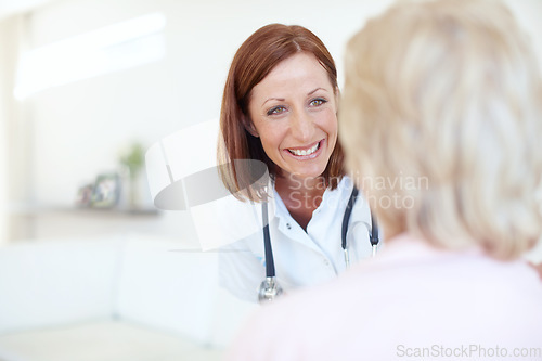 Image of A comforting and friendly presence to her patients. Friendly mature nurse visits her elderly female patient with a smile - Copyspace.