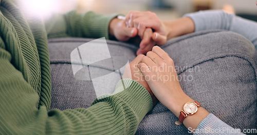 Image of Closeup, home and couple with love, holding hands and support with romance, bonding together and relax. Romantic, man and woman with connection, affection and marriage with relationship and apartment