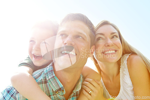 Image of Looking forward to family fun-filled vacation. A cute young family spending time together outdoors on a summers day.