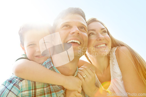 Image of Looking forward to a brilliant summer. A cute young family spending time together outdoors on a summers day.