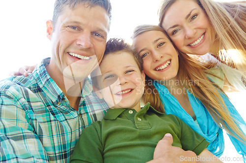 Image of Theyre a close-knit family. A cute young family spending time together outdoors on a summers day.