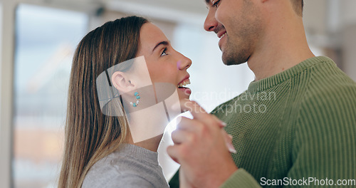 Image of Love, dancing and young couple bonding at apartment on a romantic date listening to music or playlist. Happy, positive and man and woman from Canada moving to song in living room of modern home.