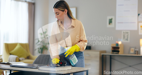 Image of Woman, spray bottle and cleaning table in house, disinfection and maintenance service or fluid. Female person, gloves and antibacterial or detergent, chemical and hygiene or bacteria in home office