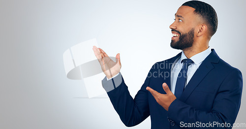 Image of Offer, pointing and corporate businessman in studio with smile, deal announcement and mockup space. News, advice and happy man with choice, presentation or business opportunity on white background.