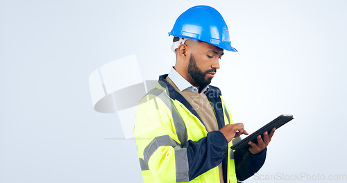 Image of Man, tablet and typing online for engineering, project management and construction update in studio. Industry worker with digital technology for blueprint or architecture plan on a white background