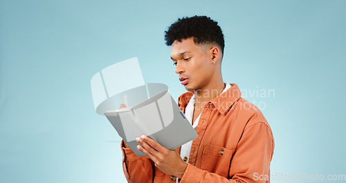 Image of Thinking, notebook and writing with man, planning and ideas with creativity on a blue studio background. Person, guy and model with problem solving, vision or education with student and knowledge