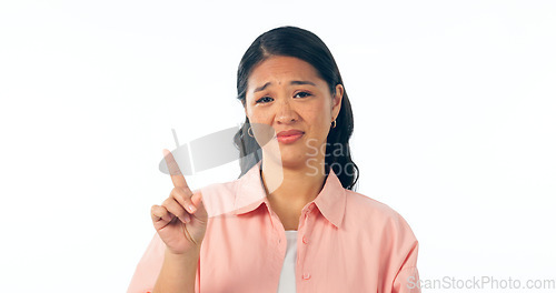 Image of Face, hand pointing and woman with no finger in studio for review, feedback or warning on white background. Portrait, vote and Japanese lady model with protest emoji, voice or option, fail or mistake