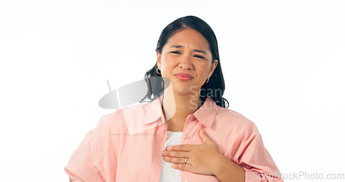 Image of Chest pain, portrait and woman in studio for heartburn, anxiety or emergency on white background. Stress, face and Asian model with lung, asthma or breathing problem, fail or indigestion reflux