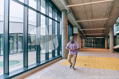 Image of Amidst an atmosphere of exuberance, a joyful, blonde man energetically departs for a business meeting, radiating positivity, enthusiasm, and a vibrant spirit in the contemporary corporate world