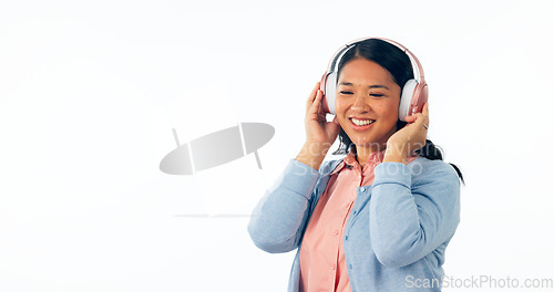 Image of Headphones, happy or woman in listening to music, playlist or podcast for entertainment. Smile, asian female and relax to stream a song, online radio subscription and technology by white background