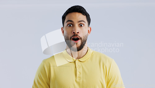 Image of Portrait, man and surprise with announcement, wow and expression on a white studio background. Face, person and model with emoji, shocked and omg with news, gossip and reaction with mockup space
