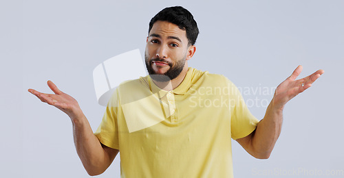 Image of Man, hands and confused portrait in studio, question and unsure of options by white background. Idea, why and young person with doubt for decision, uncertain and shoulder shrugging by mockup space