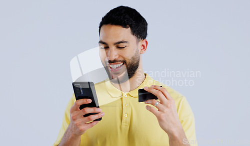 Image of Man, smartphone and happy with credit card for digital transaction, ecommerce and online shopping on white background. Young person, mobile and technology for iot, banking payment and studio mockup