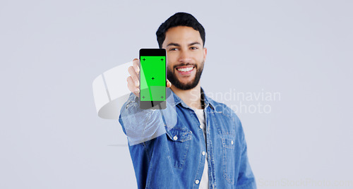 Image of Man, smartphone or green screen in portrait with smile, mockup space or happy for advertising. Arab person, phone or face in marketing by tracking markers, mobile app or contact by white background