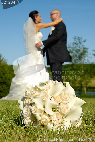 Image of Wedding bouquet and couple