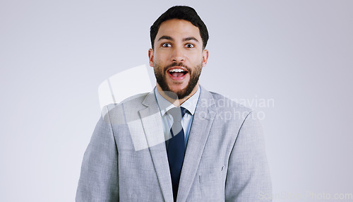 Image of Business, man or portrait with surprised in studio for target, payment or bonus opportunity on gray background. Professional, person or employee and wow for announcement or promotion on mock up space