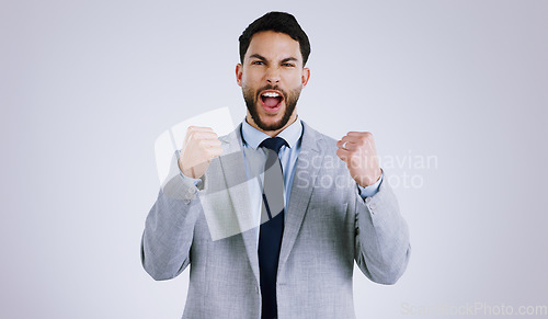 Image of Happy businessman, portrait and fist pump in celebration, winning or achievement against a gray studio background. Excited man employee in prize, good news or business promotion for success on mockup
