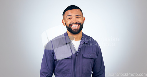 Image of Portrait, laugh and happy business man in studio with humor, joke or funny personality on grey background. comic, face and isolated entrepreneur with confidence, positive attitude or feel good mood