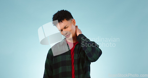 Image of Stress, joint and man with neck pain, injury or muscle tension with burnout on a blue background. Person, guy or model with fibromyalgia, osteoporosis anatomy or problem with accident or mockup space