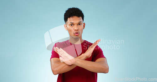 Image of Portrait, man and cross for no in studio for mockup of protest, rejection and warning with sign. Male model, talking and opinion on human rights, equal pay or social justice in space with gesture