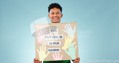 Image of Man, protest poster and studio portrait for accountability to stop climate change by blue background. Happy volunteer person, social responsibility and vision for future, sustainability and ecology