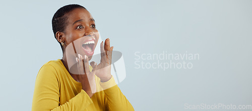 Image of Happy black woman, face and screaming in surprise, winning prize or celebration against a studio background. Excited African female person in wow, shock or bonus promotion on sale discount or deal