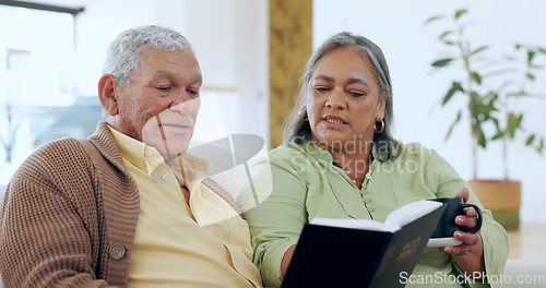 Image of Senior, couple and bible with coffee for religion, worship and spiritual on sofa in living room of home. Elderly, man and woman with book of God on couch for faith, christian and trust with happiness