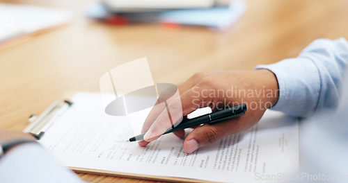 Image of Closeup, hand and pen for contract in office for legal agreement, compliance or paperwork. Male person, lawyer and reading for document with information, life insurance and protection plan on desk