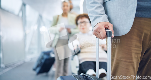 Image of Hand, luggage and a business person in an airport for travel, waiting in line for boarding a flight closeup. Gate, terminal and a corporate employee with a suitcase for bag on a trip or journey