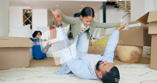 Image of Father, daughter and airplane or play in new home with happy, fun and bonding for relocation in hallway. Family, man and girl kid or lifting in knees for game or freedom in real estate or apartment