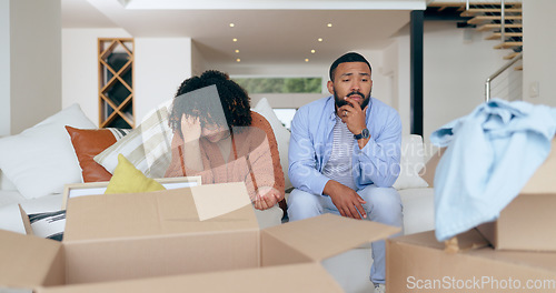 Image of New home, box and frustrated couple for moving, property investment and renting house. Conflict, argue and man and woman with crisis, problem and fight for mortgage, apartment or real estate purchase