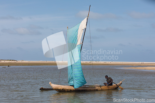 Image of A fisherman sails back from the sea Morondava, Madagascar