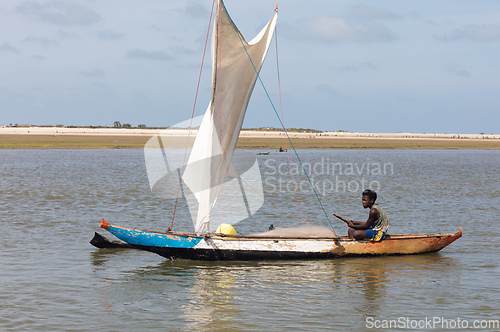 Image of A fisherman sails back from the sea Morondava, Madagascar
