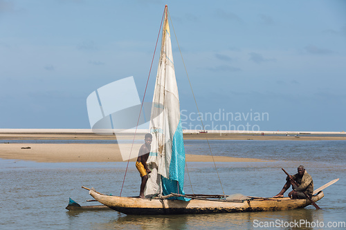 Image of A fisherman sails back from the sea Morondava, Madagascar