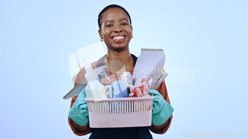 Image of Woman, portrait and happy in studio for cleaning service, housekeeping or home improvement on blue background. Black person, face and smile with holding bucket, product or detergent on mock up space