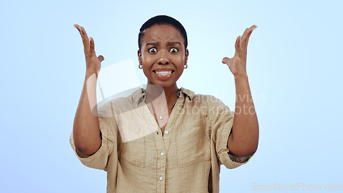 Image of Portrait, black woman and surprise with announcement, shocked and facial expression on a blue background. Face, African person and model with reaction, emoji and mockup space with emotion, wow or omg