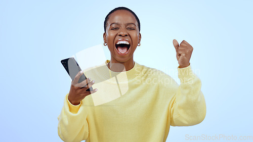 Image of Woman, phone and wow for happy news, social media competition or giveaway success on a blue background. Portrait of African person with surprise, excited and yes for sale or bonus on mobile in studio