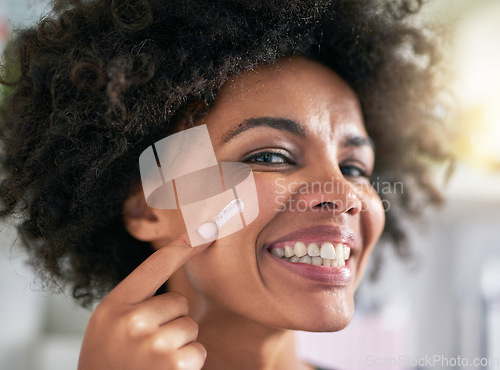 Image of Portrait, woman and hand with moisturiser for skincare, treatment and facial in home. Black person, happy and smile for dermatology, result and hydration with collagen boost, lotion and sunscreen