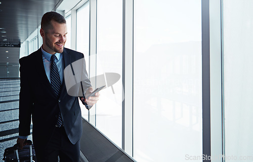 Image of Corporate man, phone and window in airport corridor for reading, thinking or communication on business travel. Entrepreneur, luggage and smartphone for flight schedule or global immigration in London