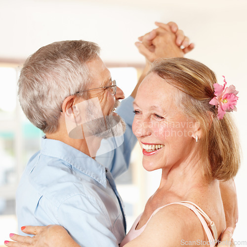 Image of Senior couple, dancing and happy in home, romantic and ballroom for fun, touch and love. Retirement, bonding together and smile for husband, wife and quality time with tango, retired and elderly