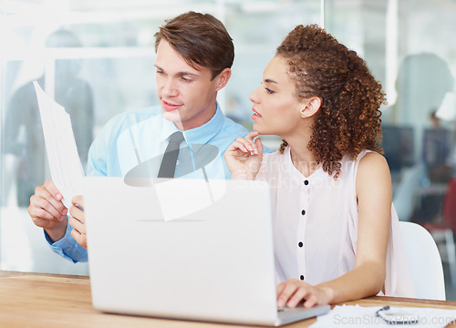 Image of Laptop, document and business people in collaboration in the office planning a legal agreement. Professional, paperwork and team of lawyers in discussion with contract and computer in workplace.