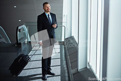 Image of Flight, thinking or business man in airport with phone, luggage or suitcase waiting for booking. Social media, happy smile or corporate worker texting to chat on mobile app on international travel