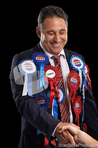 Image of Man, vote and handshake with ribbon, happy and politician for support, government and politics. Elections, voter choice and representative for party, registration and democracy for voting register