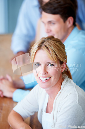 Image of Woman, portrait and smile in team meeting, office and collaboration or teamwork, workshop and seminar. Happy people, confidence and positive mindset at company, future and growth or face in boardroom