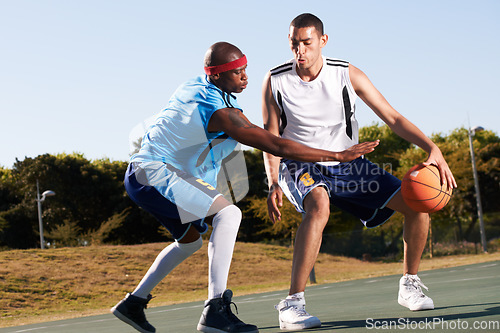 Image of Men, player and basketball game or defense in court challenge team, dunk on rival. Male people, running dribble and score point in summer park in fitness clothes for competition, athlete for winning